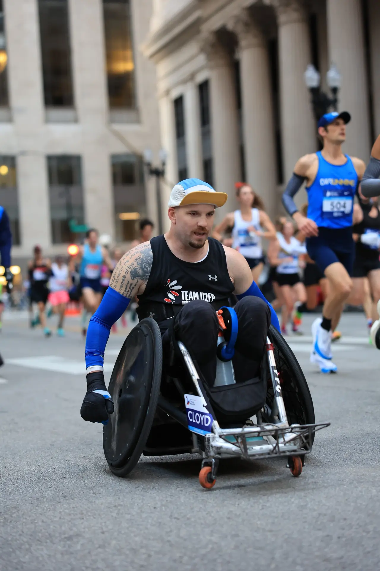 Thomas Cloyd pushing his racing wheelchair through the streets of Chicago